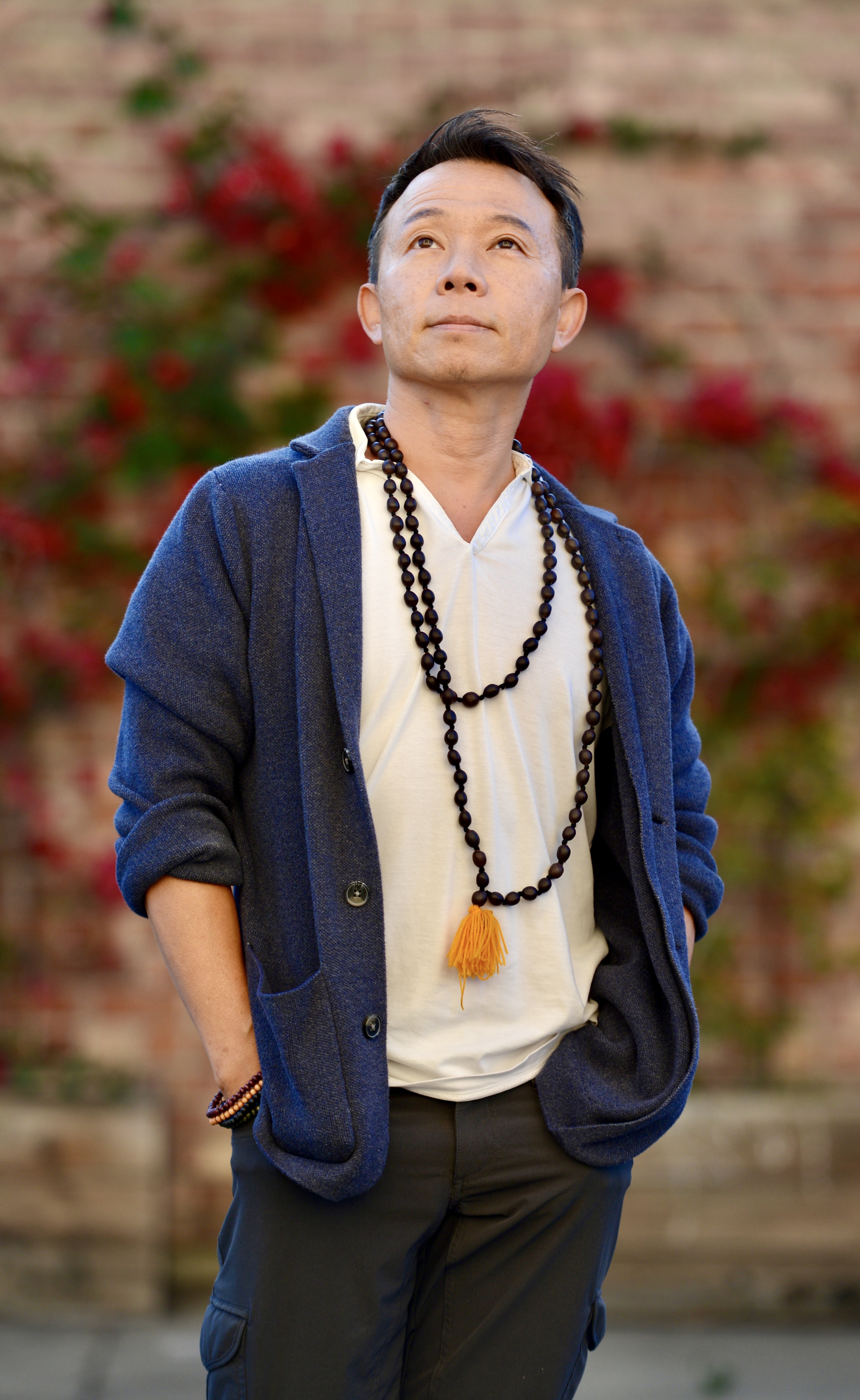 David Cho portrait, wearing mala beads